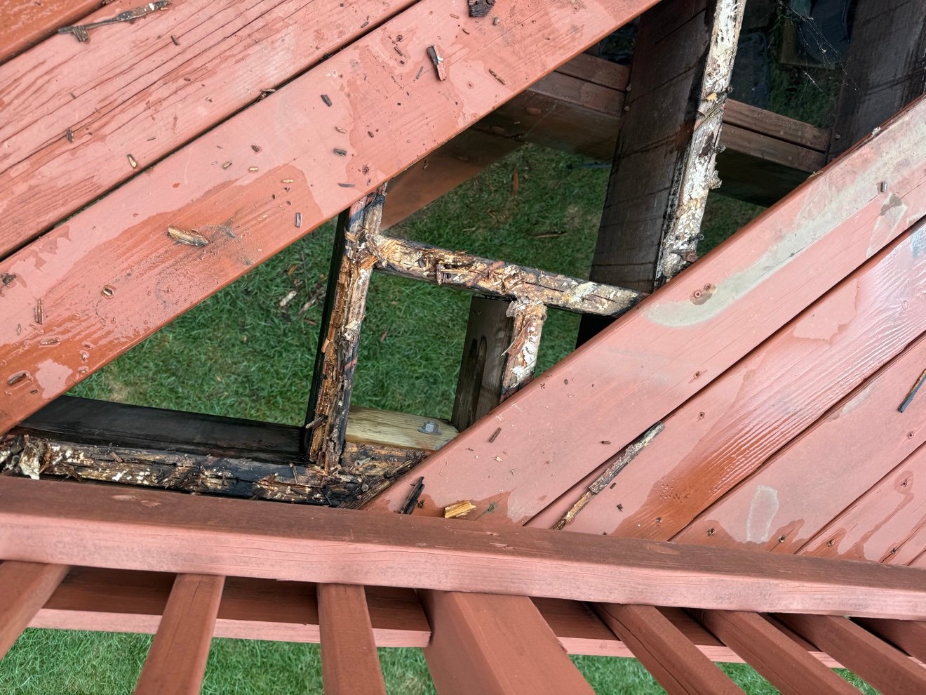 Rotted deck framing exposed
