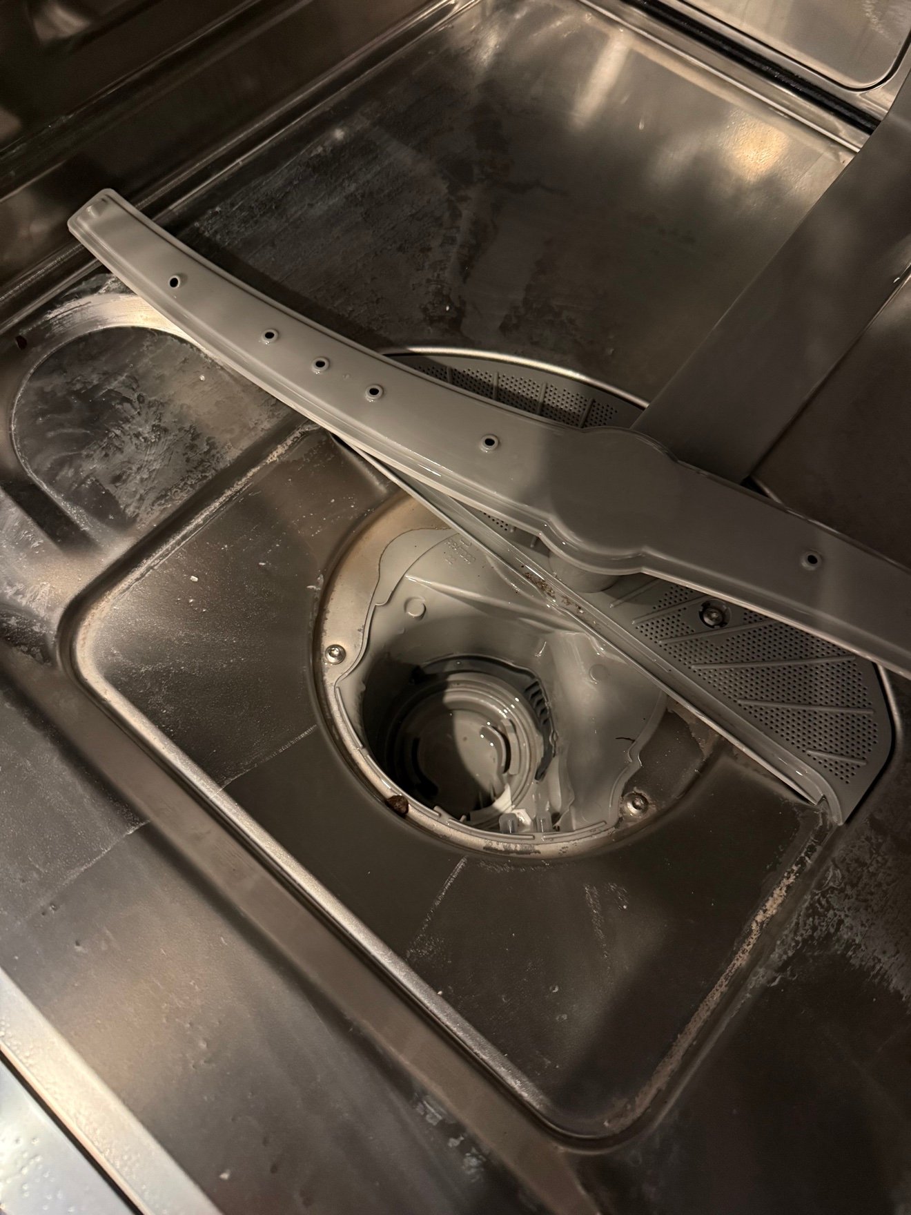 Inside dishwasher during repair