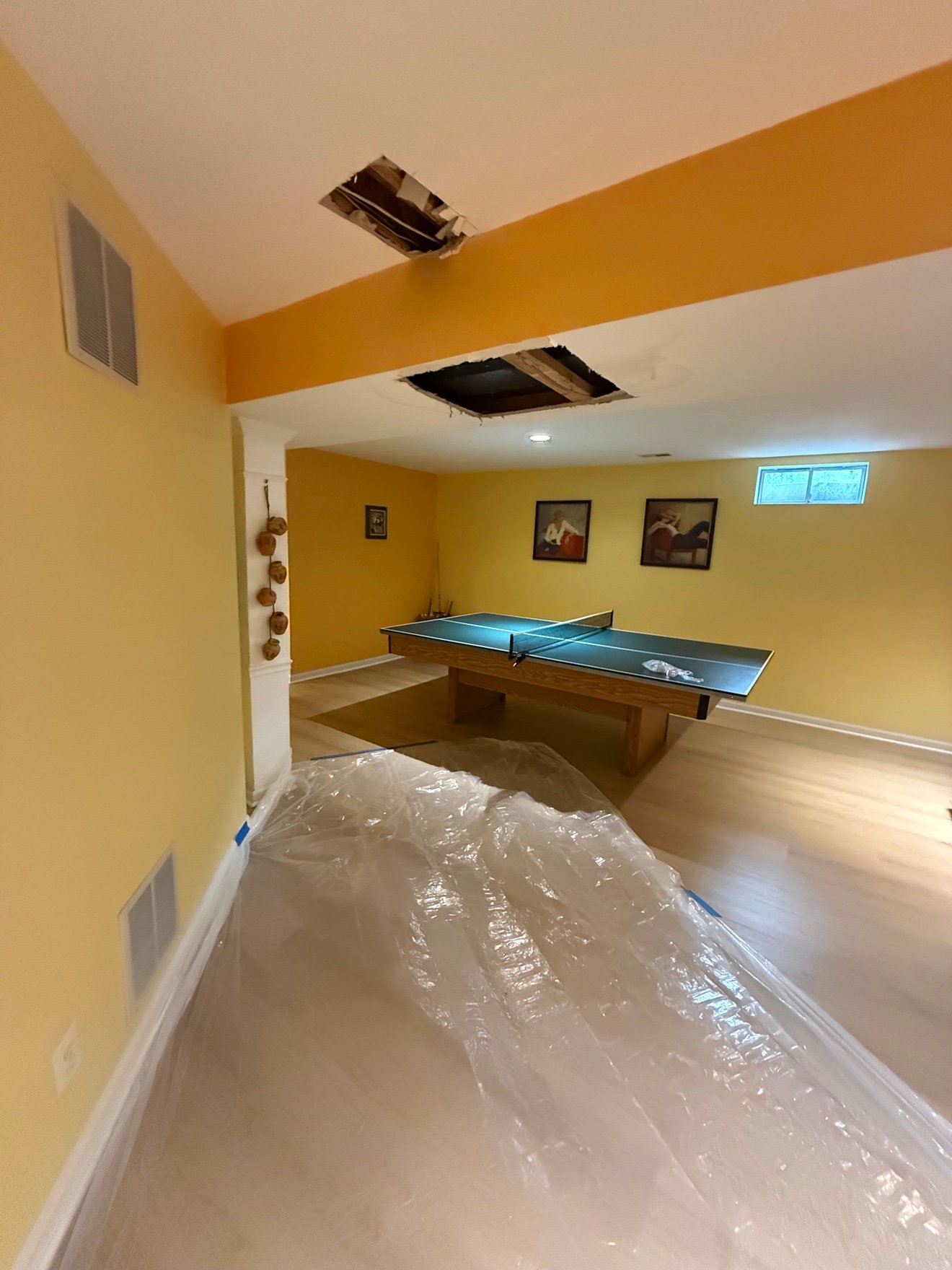 Ceiling holes cut open before repair