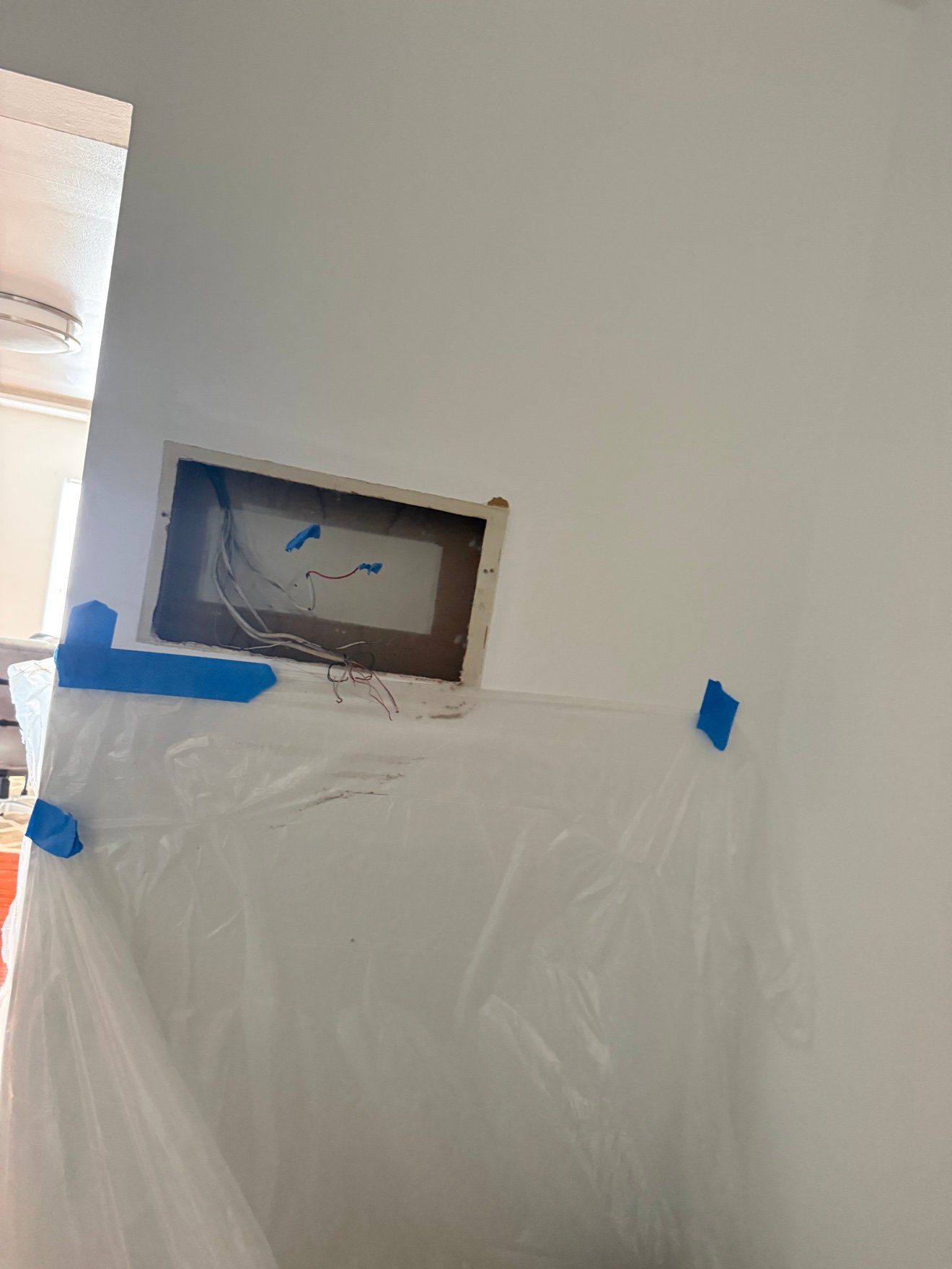 Wall opened exposing electrical wiring