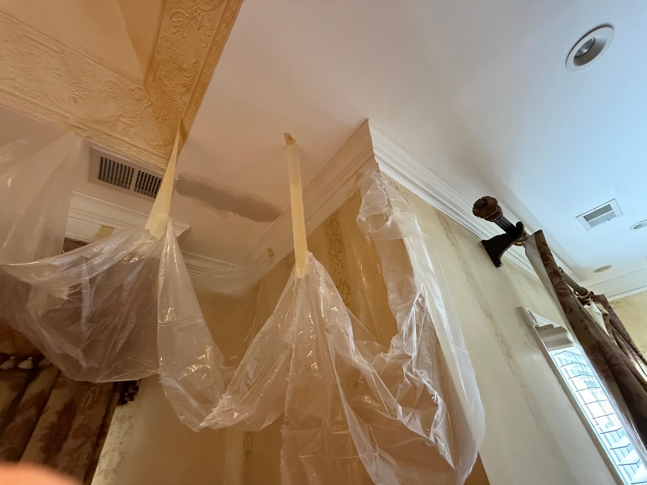 Ceiling repair prep with dust sheeting