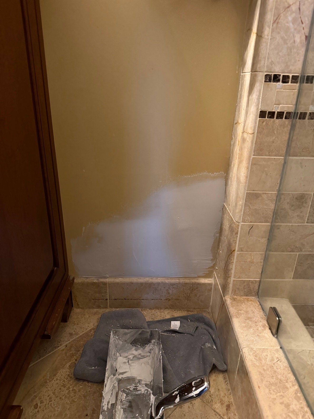 Bathroom wall patch with joint compound