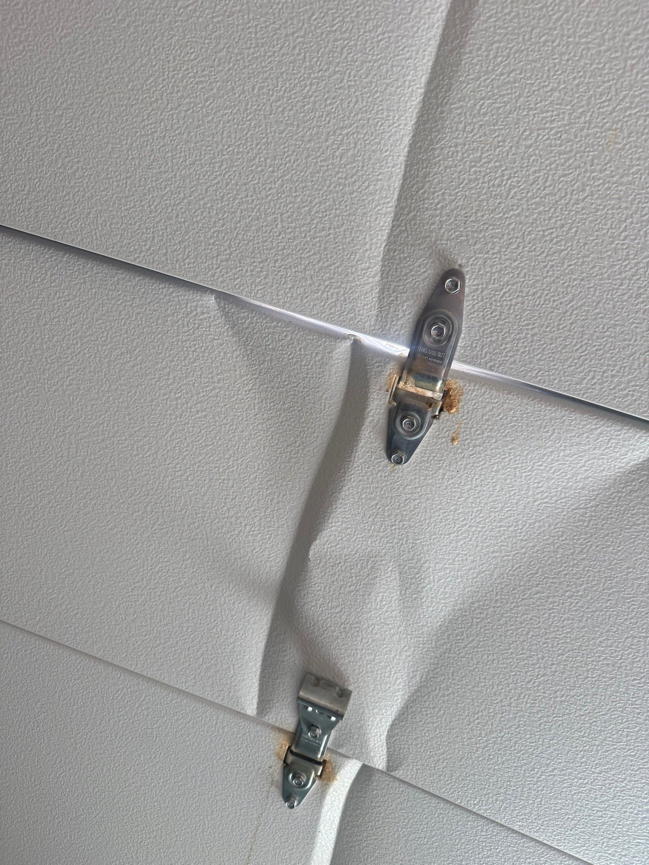 Garage door hinge repair
