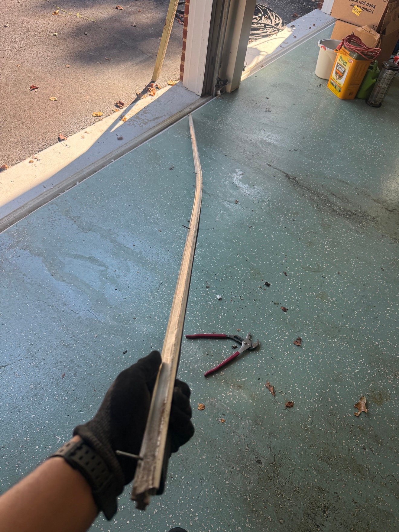 Damaged garage door hardware removed