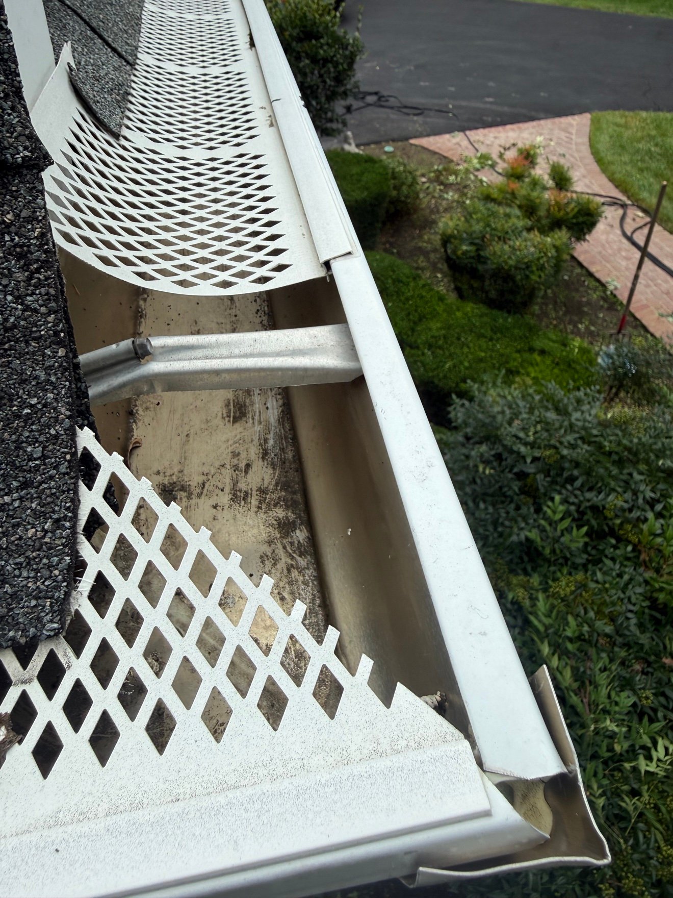 Gutter guard installation in progress