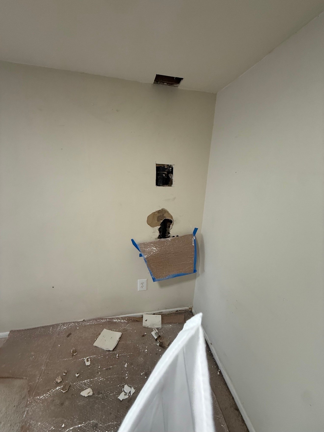 Wall opened for plumbing access