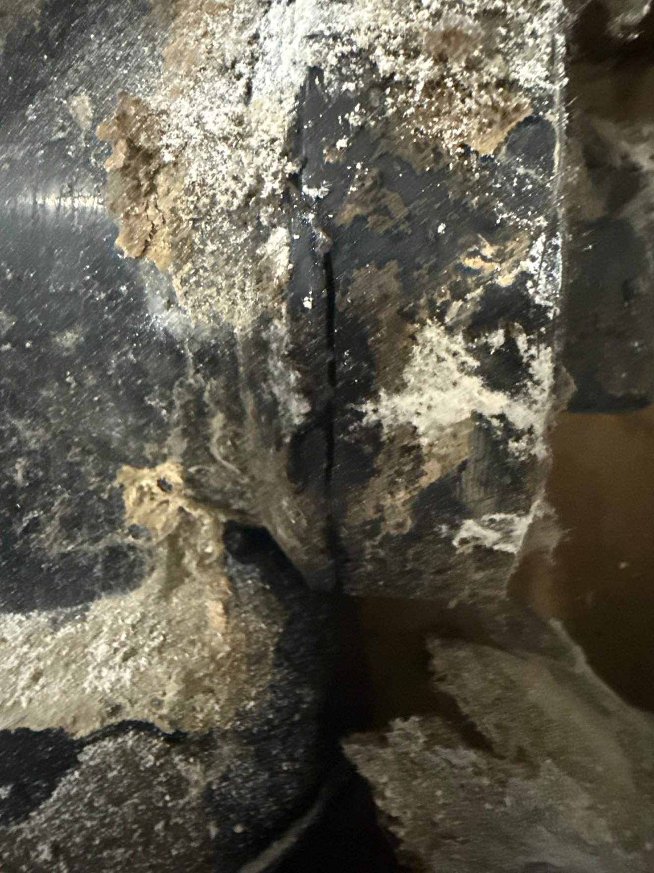 Corroded cast iron drain pipe