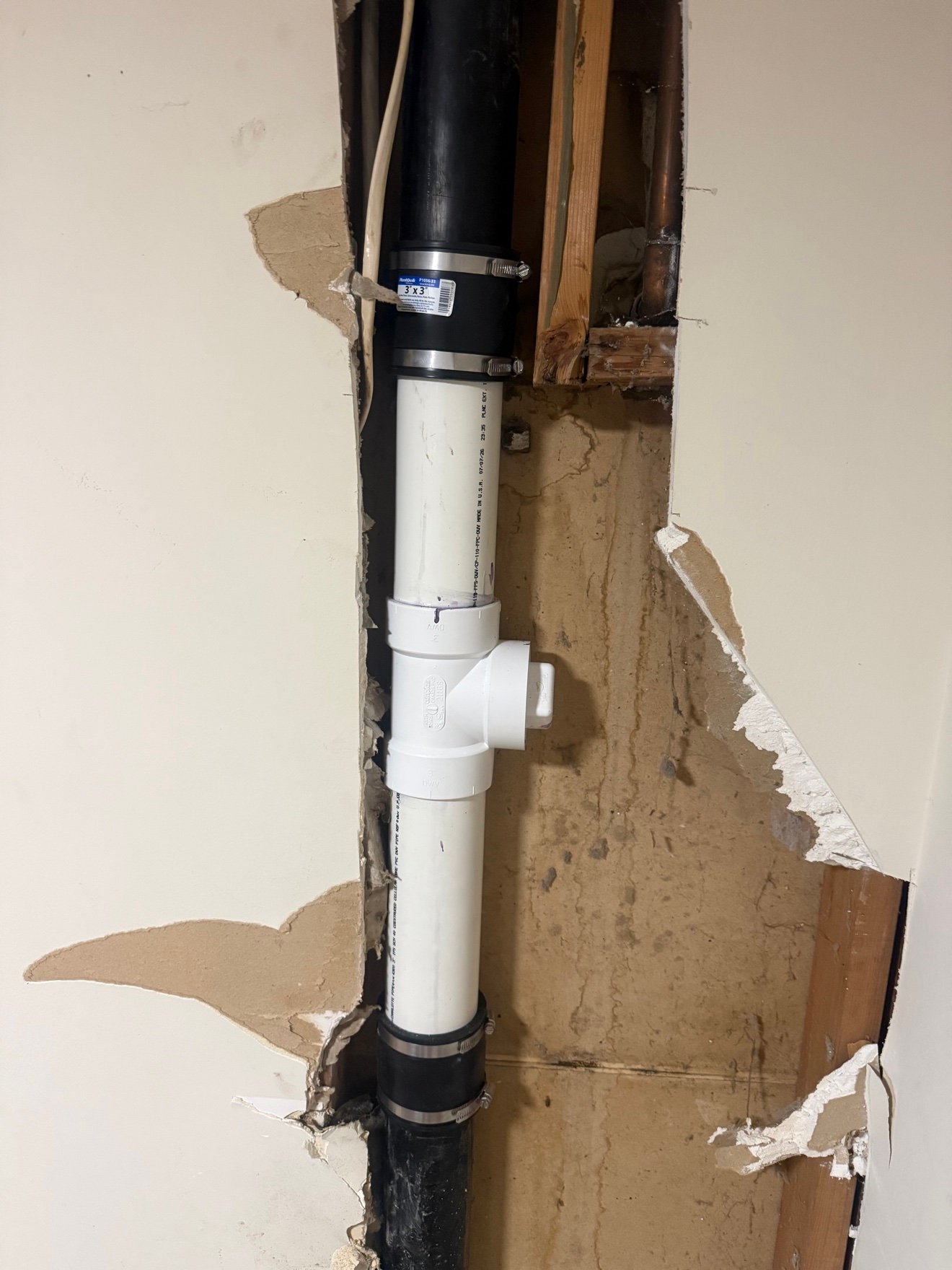 New PVC drain stack with cleanout installed
