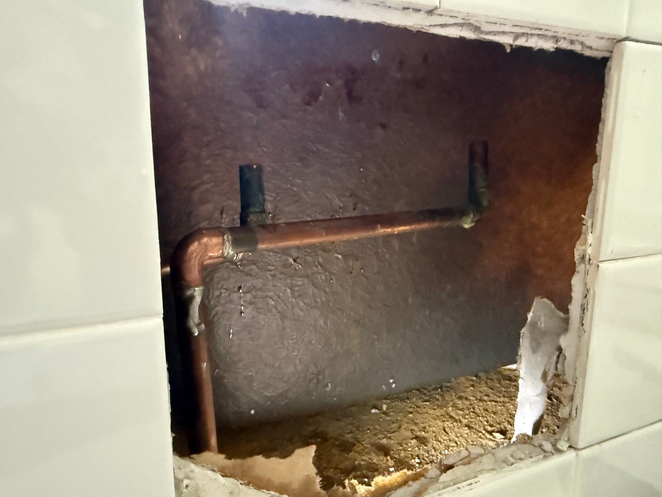 New copper connections inside tub wall
