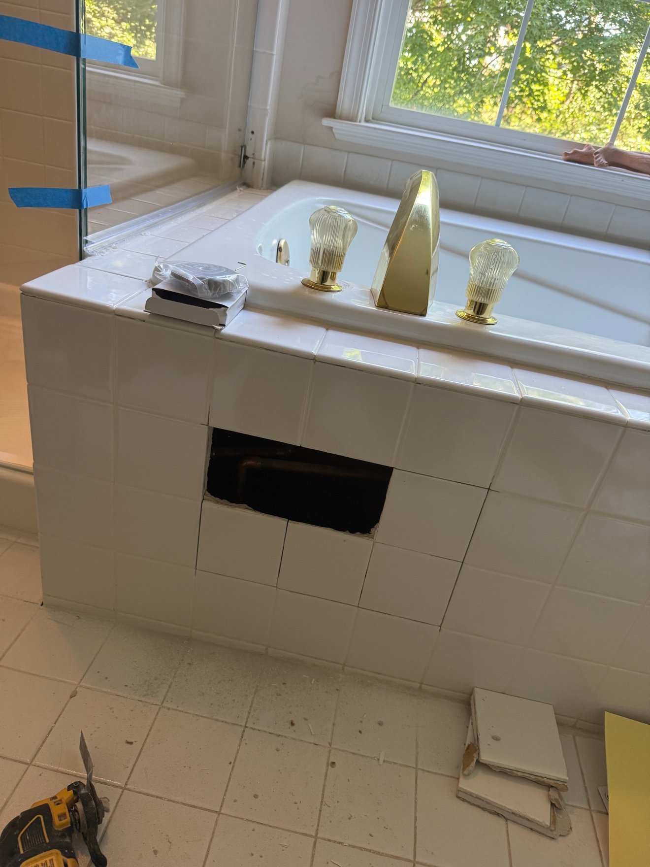 Tub wall opened for new faucet install