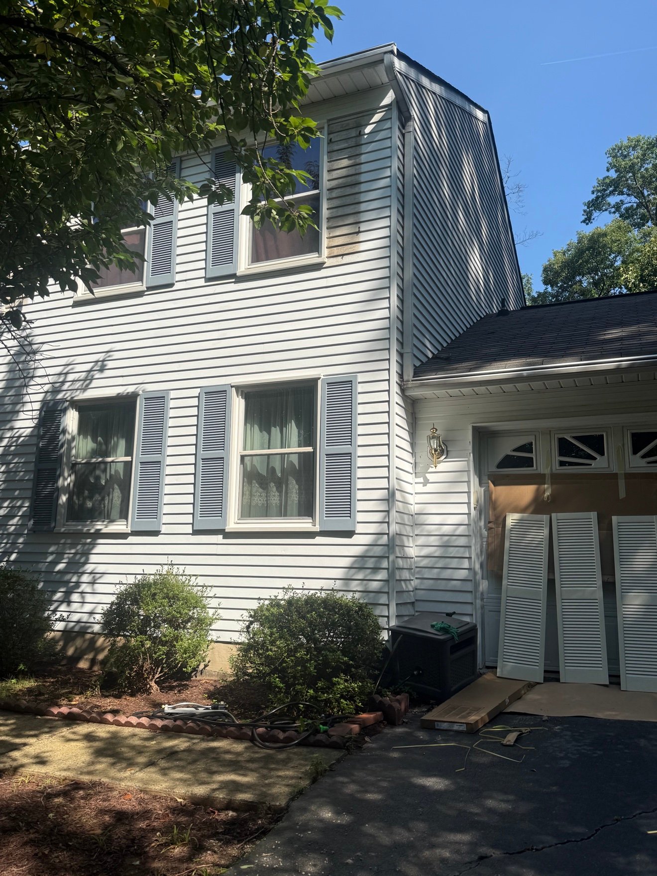 New painted shutters installed, side view